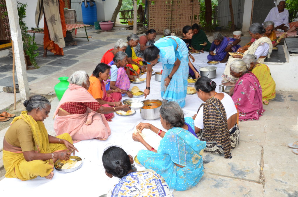 women serving food to needy